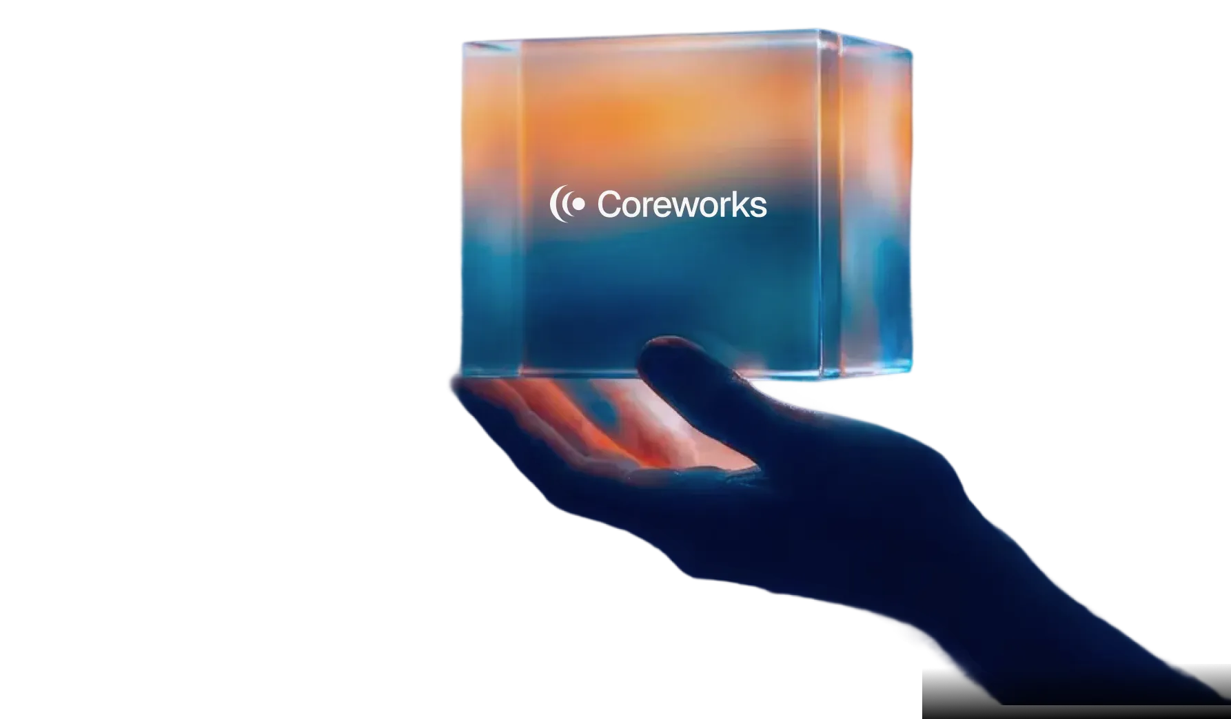 Hand holding glass cube with Coreworks logo